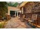 Inviting outdoor patio with stone flooring, a covered pergola, and comfortable seating at 2 University Ln, Greenwood Village, CO 80121