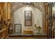 Charming wine cellar featuring brick archway, stone countertop, and custom bottle racks at 2 University Ln, Greenwood Village, CO 80121