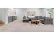 Finished basement featuring a large sectional sofa, custom wet bar, and plush carpeting at 2501 Vrain St, Denver, CO 80212