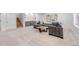 Basement featuring a large sectional sofa, a wooden coffee table, and a custom wet bar at 2501 Vrain St, Denver, CO 80212