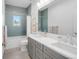 Charming bathroom featuring double vanity, quartz countertops, and stylish tilework in the shower at 2501 Vrain St, Denver, CO 80212