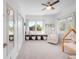 Bright bedroom with large windows, built-in shelving, and a cozy reading nook at 2501 Vrain St, Denver, CO 80212