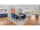 Open concept dining room with modern light fixture and view into the living room at 2501 Vrain St, Denver, CO 80212