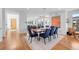 Elegant dining area with modern lighting, seating for eight, and hardwood floors at 2501 Vrain St, Denver, CO 80212