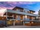Striking modern home featuring balconies, multiple garage doors, and a sleek design at 2501 Vrain St, Denver, CO 80212