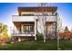 Contemporary home exterior with clean lines, multiple balconies, and manicured front lawn at 2501 Vrain St, Denver, CO 80212