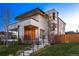 Contemporary home with modern design, landscaped yard, and inviting front porch with entry stairs at 2501 Vrain St, Denver, CO 80212