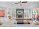 Bright living room with fireplace, large windows, and access to the outdoor balcony at 2501 Vrain St, Denver, CO 80212