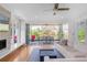 Spacious living room with a fireplace and doors opening to an outdoor deck with seating at 2501 Vrain St, Denver, CO 80212