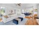 Bright open-concept living space with hardwood floors, modern furniture, and recessed lighting at 2501 Vrain St, Denver, CO 80212