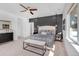 Modern main bedroom featuring a dark accent wall, neutral carpet, and stylish decor at 2501 Vrain St, Denver, CO 80212