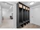 Well-organized mudroom featuring built-in shelving, storage lockers, and tile flooring at 2501 Vrain St, Denver, CO 80212