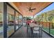 Covered outdoor deck with dining table, ceiling fan and outdoor furniture at 2501 Vrain St, Denver, CO 80212