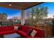 Cozy outdoor patio with comfortable red seating and views of the neighborhood and evening sky at 2501 Vrain St, Denver, CO 80212