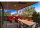 Covered patio with comfortable seating and outdoor dining, perfect for entertaining and relaxation at 2501 Vrain St, Denver, CO 80212