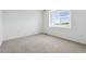This bedroom features a large window and carpeted floors at 19080 E 96Th Pl, Commerce City, CO 80022