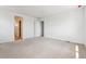 This bedroom features carpeted floors and two open doorways at 19080 E 96Th Pl, Commerce City, CO 80022