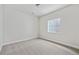 Simple and bright bedroom with neutral carpeting at 3242 Boral Owl Dr, Brighton, CO 80601