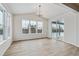 Bright dining area with hardwood floors and sliding glass doors to patio at 3242 Boral Owl Dr, Brighton, CO 80601