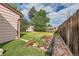 Landscaped backyard with garden and shed at 1851 S Perry Way, Denver, CO 80219