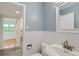 Clean bathroom, featuring a white sink and shower/tub combo at 1851 S Perry Way, Denver, CO 80219