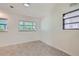 Spacious dining area with large windows and built-in shelving at 1851 S Perry Way, Denver, CO 80219