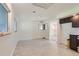 Bright dining area features hardwood floors and a view into the living room at 1851 S Perry Way, Denver, CO 80219