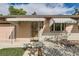 Inviting front entrance with decorative security door and awning at 1851 S Perry Way, Denver, CO 80219