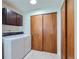 Laundry room complete with washer, dryer and additional storage at 1851 S Perry Way, Denver, CO 80219