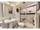 Charming bathroom with a pedestal sink, tiled shower, and stylish fixtures at 16364 Flintlock Ct, Parker, CO 80134