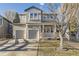 Two-story home with a two-car garage, covered porch, and neutral-colored siding at 16364 Flintlock Ct, Parker, CO 80134