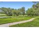 Expansive green space, walking path, and native grasses offer a serene natural setting at 3315 S Ammons St # 103, Lakewood, CO 80227