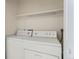 Convenient laundry area equipped with a side-by-side washer and dryer for easy laundry days at 3315 S Ammons St # 103, Lakewood, CO 80227
