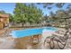 Sparkling community pool surrounded by lounge chairs offers a relaxing oasis for residents at 3315 S Ammons St # 103, Lakewood, CO 80227