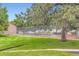 Community tennis court provides a recreational amenity for residents, surrounded by lush greenery at 3315 S Ammons St # 103, Lakewood, CO 80227