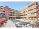 View of the courtyard in a brick building with multiple stories and staircases at 655 N Pearl St # 108, Denver, CO 80203