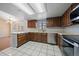 Well-equipped kitchen with stainless steel appliances and ample counter space at 9803 E Exposition Ave, Denver, CO 80247