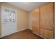 Eat-in kitchen featuring oak cabinets and door to backyard at 9803 E Exposition Ave, Denver, CO 80247