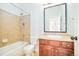 Bathroom featuring a shower over tub combination and a vanity with storage at 7777 E 23Rd Ave # 1401, Denver, CO 80238