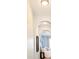 Hallway with an arched entryway leading to a serene bedroom at 7777 E 23Rd Ave # 1401, Denver, CO 80238