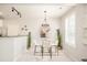Bright dining area features modern lighting, neutral paint, and decorative accents at 7777 E 23Rd Ave # 1401, Denver, CO 80238