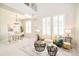 Bright and open living area with large windows, a cozy seating arrangement, and an adjacent dining space at 7777 E 23Rd Ave # 1401, Denver, CO 80238