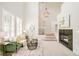Bright and airy living room featuring vaulted ceilings, a cozy fireplace, and elegant decor at 7777 E 23Rd Ave # 1401, Denver, CO 80238