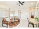 Upstairs living area features ceiling fan and comfortable seating at 7777 E 23Rd Ave # 1401, Denver, CO 80238