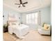 Tranquil main bedroom with soft blue walls and tray ceiling at 7777 E 23Rd Ave # 1401, Denver, CO 80238