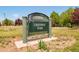 A Greenway Park sign surrounded by green space at 7777 E 23Rd Ave # 1401, Denver, CO 80238