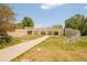 A park with a walking path and a shaded structure with seating in a landscaped area at 7777 E 23Rd Ave # 1401, Denver, CO 80238