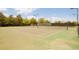 An outdoor tennis court with mature shade trees at 7777 E 23Rd Ave # 1401, Denver, CO 80238