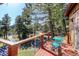 Charming deck features a small table and chairs with scenic views at 1051 Sleepy Hollow Rd, Golden, CO 80401