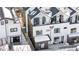 Aerial view shows a modern townhome with a rooftop deck at 3955 W 13Th Ave, Denver, CO 80204